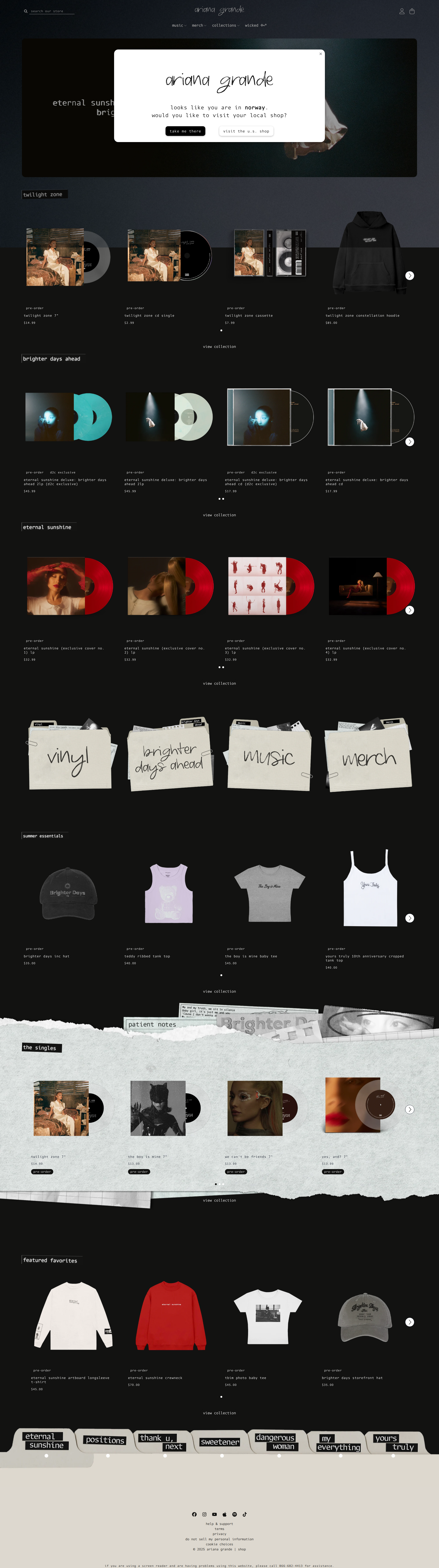 Ariana Grande - This is the homepage of Ariana Grande's official merchandise store, featuring a dark-themed layout with multiple product sections displaying vinyl records, apparel, and other merchandise organized in grid layouts with category folders.