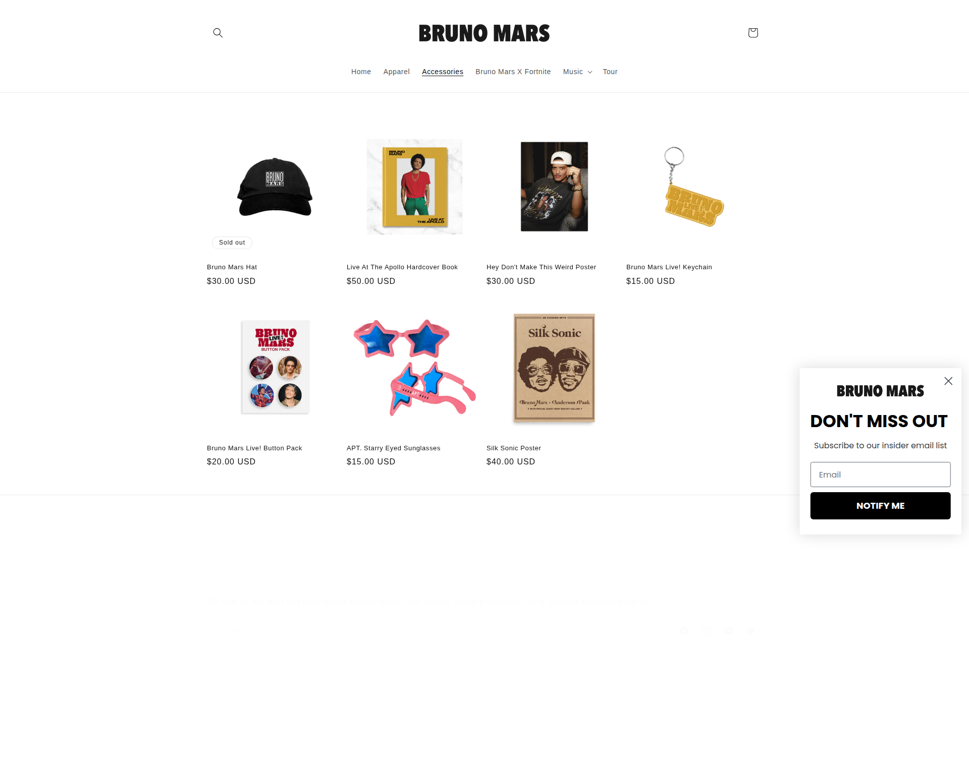 Bruno Mars - A Bruno Mars merchandise product listing page displaying a grid of various items including hats, books, posters, keychains, button packs, sunglasses, and other accessories with prices and product images. A newsletter signup modal popup is overlaying the main content.